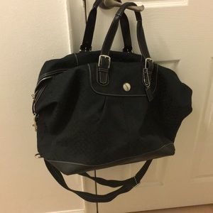 Coach  black monogrammed luggage, duffel bag